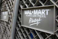 <p>               Shopping carts are photographed outside the Wal-Mart store in Mayfield Hts., Ohio on Monday, Nov. 14, 2011. Wal-Mart is reporting that the third-quarter profits slipped 2.9 percent and offered a conservative fourth-quarter outlook. But the world's largest retailer announced its first quarterly gain in its U.S. namesake business, reversing a more than two year sales slump. (AP Photo/Amy Sancetta)