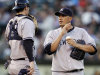 New York Yankees' Freddy Garcia, right, speaks with catcher Chris Stewart in the fourth inning of a baseball game against the Oakland Athletics, Thursday, July 19, 2012, in Oakland, Calif. (AP Photo/Ben Margot)