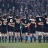 The All Blacks link arms as they sing the national anthem for their test against Ireland at Eden Park in Auckland