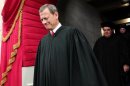 Supreme Court Chief Justice John Roberts and Supreme Court Justice Antonin Scalia arrive for the presidential inauguration on the West Front of the U.S. Capitol in Washington