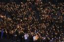 Students from Danwon high school and other people attend candlelight vigil to wish for safe return of missing passengers from South Korean ferry "Sewol", which sank in the sea off Jindo, in Ansan