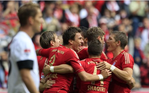 Bayern Munich's Mandzukic celebrates with team mates goal against Mainz 05 during German Bundesliga soccer match in Munich