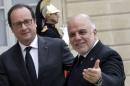 French President Hollande greets Iraq's Prime Minister al-Abadi as he arrives at the Elysee Palace in Paris