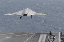 A X47-B Navy Drone is launched from the deck of the nuclear aircraft carrier USS George H. W. Bush off the Coast of Virginia Wednesday, July 10, 2013. It is the first landing by a drone on a Navy carrier. The landing of the X-47B experimental aircraft means the Navy can move forward with its plans to develop another unmanned aircraft that will join the fleet alongside traditional airplanes to provide around-the-clock surveillance while also possessing a strike capability. (AP Photo/Steve Helber)