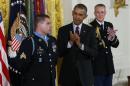 U.S. President Obama applauds Medal of Honor recipient White during White House ceremony in Washington