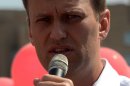 Russian opposition leader Alexey Navalny delivers a speech during a campaign meeting in Moscow on August 8, 2013