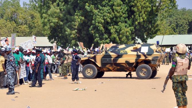 File photo shows police and soldiers blocking a road as they secure the venue during a rally of the ruling People&#39;s Democratic Party (PDP) in Maiduguri, northeast Nigeria on January 24, 2015
