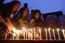 Artists and activists attend a candlelight vigil in tribute of former South Africa President Nelson Mandela, in Dhaka
