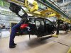 Employee of German car manufacturer Mercedes Benz works on a Mercedes B-class car at the Mercedes plant in Rastatt