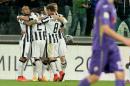 Juventus' players celebrates after Carlos Tevez scored during a Serie A soccer match between Juventus and Fiorentina at the Juventus stadium, in Turin, Italy, Wednesday, April 29, 2015. (AP Photo/Massimo Pinca)