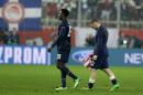 Manchester United's Wayne Rooney, right, and Danny Welbeck leave the pitch after Champions League, round of 16, first leg soccer match against Olympiakos at Georgios Karaiskakis stadium, in Piraeus port, near Athens, on Tuesday, Feb. 25, 2014. Olympiakos won 2-0. (AP Photo/Thanassis Stavrakis)