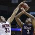 Arizona's Grant Jerrett (33) blocks a shot by Belmont's Blake Jenkins (2) during the first half in a second-round game in the NCAA college basketball tournament in Salt Lake City Thursday, March 21, 2013. (AP Photo/Rick Bowmer)