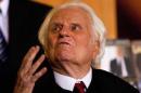 Billy Graham gestures while attending a book signing for former U.S. President George W. Bush's new book at the Billy Graham Library in Charlotte