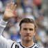 FILE- Los Angeles Galaxy's David Beckham, of England, waves as he stands with his son Romeo, in Carson, Calif., USA, in this file photo dated Saturday, Dec. 1, 2012.  It is announced Tuesday Dec. 18, 2012 that the son of soccer star David Beckham and former Spice Girl singer Victoria Beckham, ten-year old Romeo Beckham, is the new face of the London based clothing brand Burberry and will feature in upcoming ads for Burberry’s spring/summer 2013 collection. (AP Photo/Jae C. Hong, FILE)
