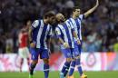 Porto's Pablo Osvaldo, left, Andre Andre and Ivan Marcano, right, celebrate their victory at the Portuguese League soccer match between FC Porto and SL Benfica at Porto's Dragao stadium in Porto, Portugal, Sunday, Sept. 20, 2015. Andre scored the only goal in Porto's 1-0 victory. (AP Photo/Paulo Duarte)