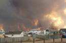 Alberta declares emergency as fires threaten Canada oil town