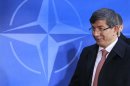 Turkish Foreign Minister Ahmet Davutoglu arrives at a two-day NATO foreign ministers at the Alliance's headquarters in Brussels