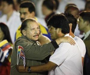 Daniel Ortega hugs Evo Morales before the march of the torches in celebration of the 161th birth anniversary of Jose Marti in Havana