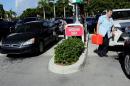 People line up to fill their cars with gas in anticipation of Hurricane Matthew, in Coral Springs