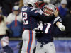 New England Patriots quarterback Tom Brady (12) celebrates his touchdown pass to tight end Rob Gronkowski (87) during the fourth quarter of an NFL football game in Foxborough, Mass., Sunday, Dec. 30, 2012. Gronkowski was active after missing five games with a broken left forearm. (AP Photo/Charles Krupa)