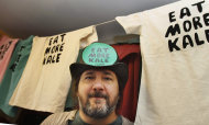 <p>               In this Nov. 22, 2011 photo, Bo Muller-Moore stands in his home studio in Montpelier, Vt. Muller-Moore, the Vermont man who is building a business around the term "eat more kale," which has been plastered on T-shirts, bumper stickers and other items, is running into opposition from the second largest fried chicken retailer in the country, Chick-fil-A. (AP Photo/Toby Talbot)