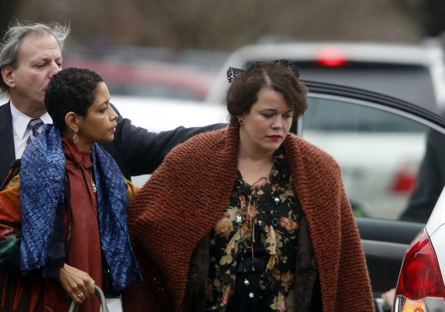 Veronika Pozner, right, arrives at a funeral service for her son, 6-year-old Noah Pozner, Monday, Dec. 17, 2012, in Fairfield, Conn. Pozner was killed when a gunman walked into Sandy Hook Elementary School in Newtown Friday and opened fire, killing 26 people, including 20 children. (AP Photo/Jason DeCrow)