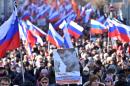Supporters of slain Russian opposition leader Boris Nemtsov take part in a memorial march marking the one-year anniversary of Nemtsov's assassination in central Moscow, on February 27, 2016