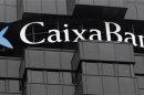 Caixabank's logo is seen on top of the company's headquarters in Barcelona