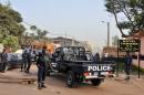 Policemen block the street near La Terrasse restaurant, in Bamako, Mali on March 7, 2015, after five people were shot dead