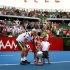 Australia's Hewitt poses with his children Mia, Ava and Cruz and the trophy after he defeated Argentina's Del Potro in the final at the Kooyong Classic tennis tournament in Melbourne