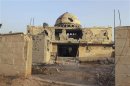 Damaged mosque is seen in Arjoun village near Qusair town, where forces of Syrian President Assad and rebel forces have been fighting