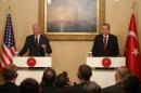 U.S. Vice President Joe Biden, left, and Turkish President Recep Tayyip Erdogan speak to the media during a joint news conference in Istanbul, Turkey, Saturday, Nov. 22, 2014. Biden on Friday became the latest in a parade of U.S. officials trying to push Turkey to step up its role in the international coalition's fight against Islamic State extremists. (AP Photo/Emrah Gurel)