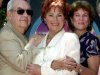 FILE - In this July 12, 2001 file photo, from left, actors Tom Bosley, Marion Ross, and Erin Moran, Williams, of the television show "Happy Days," pose  after Ross received a star on the Hollywood Walk of Fame in the Hollywood section of Los Angeles. A Los Angeles judge on Tuesday, June 5, 2012 denied a motion by CBS Studios and Paramount Pictures to dismiss claims by several former "Happy Days" cast members that they are owed royalties on DVD sales of the hit comedy series. A trial is scheduled for July.  The lawsuit was brought by cast members including Ross, Moran and Patricia Bosley, wife of Tom Bosley, who died of heart failure on Oct. 19, 2010. (AP Photo/E.J. Flynn, file)