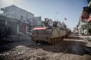 Turkish tanks are pictured in the northern Syrian town of Kobani as they return from a military operation inside Syria