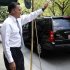 Republican presidential candidate and former Massachusetts Governor Mitt Romney waves to people gathered across the street as he leaves a finance event in New York