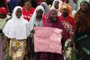 Women sing slogans during a demonstration calling on the government to rescue the kidnapped girls of the government secondary school in Chibok, in Abuja, Nigeria, Wednesday, May 28, 2014. Apparent disagreement has emerged between Nigeria's military chiefs and the president over how to rescue nearly 300 schoolgirls abducted by Islamic extremists, with the military saying use of force could get the hostages killed and the president reportedly ruling out demands for a prisoner exchange. (AP Photo/Sunday Alamba)