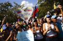 Opposition demonstrators shout slogans during a protest against President Maduro's government in Caracas