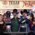 Track President Eddie Gossage, left, ducks as Jimmie Johnson (48) fires blanks out of a revolver as he celebrates in victory lane following his win in the NASCAR Sprint Cup Series auto race at Texas Motor Speedway, Sunday, Nov. 4, 2012, in Fort Worth, Texas. (AP Photo/Tim Sharp)