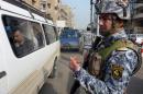 Iraqi interior ministry security forces man a checkpoint in central Baghdad on November 27, 2013