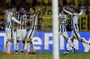Juventus players celebrate their second goal during the Champions League round of 16 second leg soccer match between Borussia Dortmund and Juventus Turin on Wednesday, March 18, 2015 in Dortmund, Germany. (AP Photo/Frank Augstein)