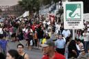 People stay on higher grounds in a tsunami safety zone after a magnitude 6.7 earthquake shook the region, in Iquique city, north of Santiago