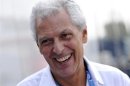 Pirelli president Tronchetti Provera smiles in the paddock after the third practice session of the Italian F1 Grand Prix at the Monza circuit