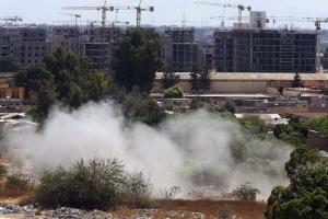 Smoke billows near a road leading to Tripoli international&nbsp;&hellip;