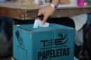 A man casts his vote at a polling station in San Salvador during the presidential election on February 2, 2014