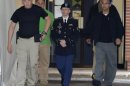 U.S. Army Private First Class Bradley Manning departs the courtroom after day four of his court martial at Fort Meade