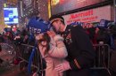 National Guardsman Cebak kisses his fiancee Babic at the start of the new year in Times Square in New York