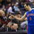 Detroit Pistons' Calderon greets announcer Kuhn before playing Toronto Raptors in their NBA basketball game in Toronto