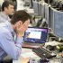 A trader reacts on the IG Group trading floor in London