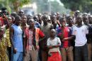 People are gathered during during a disarmament operation by French soldiers in Bangui, on December 9, 2013