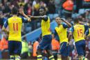 Arsenal's Danny Welbeck, 2nd left, celebrates with Mesut Ozil after scoring against Villa during the English Premier League soccer match between Aston Villa and Arsenal at Villa Park, Birmingham, England, Saturday, Sept. 20, 2014. (AP Photo/Rui Vieira)